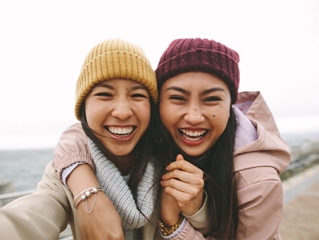 Happy sisters embracing