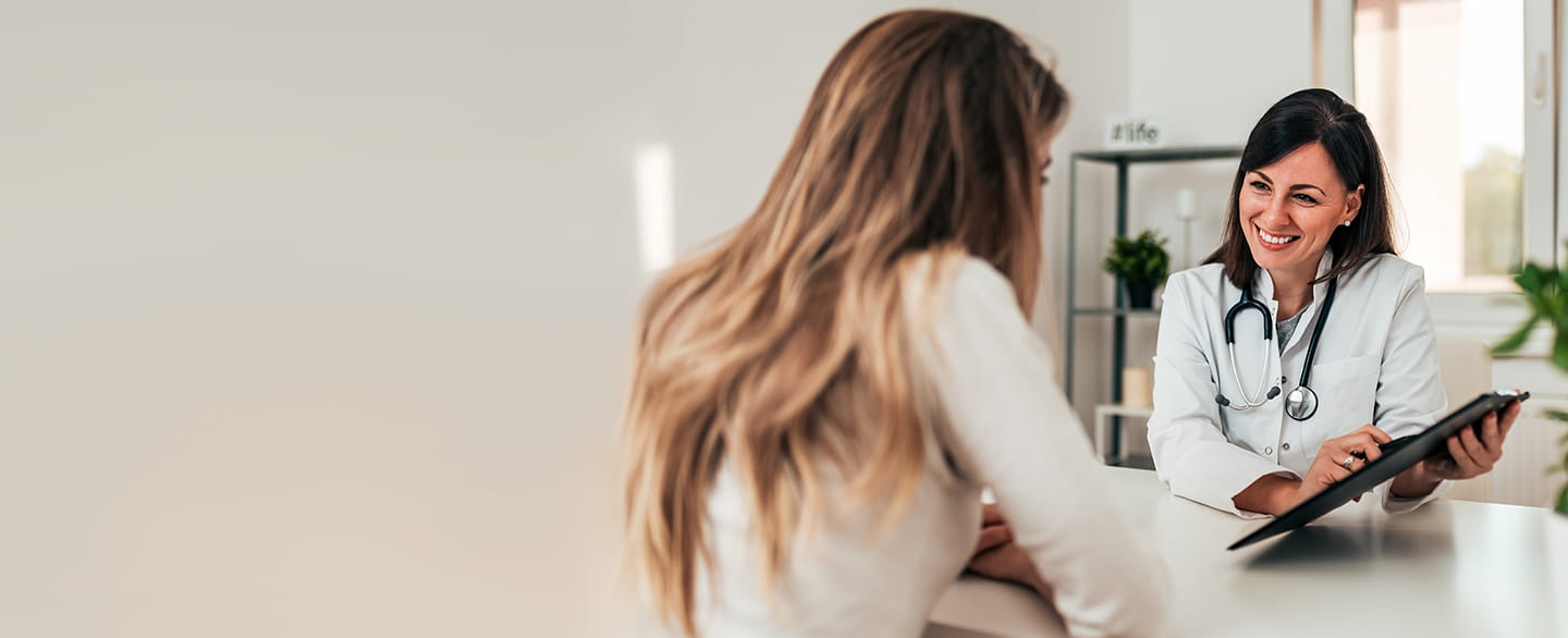Doctor visiting with patient