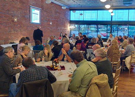 meeting in china with people sitting at tables