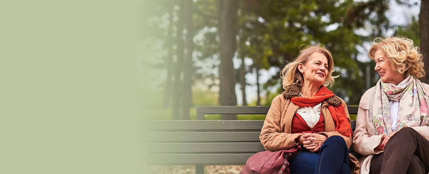 Two good friends talking and smiling.