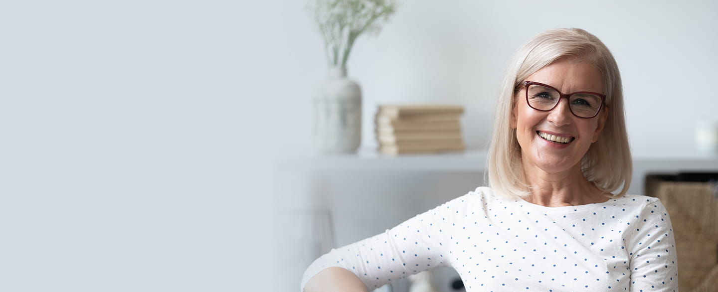 Happy woman wearing glasses.