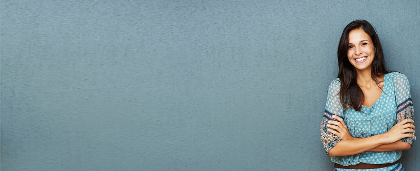 Younger woman smiling.