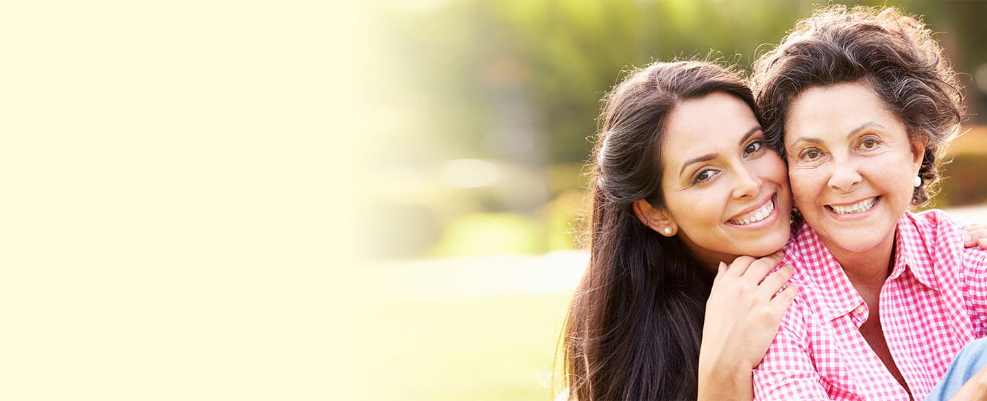 Mother and daughter smiling.
