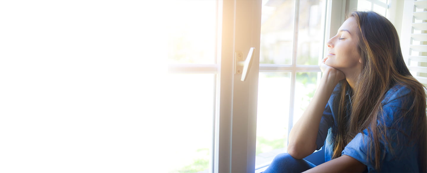 Woman looking out of the window. 