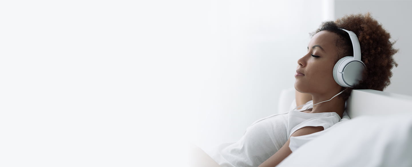 Woman relaxing and listening to music.