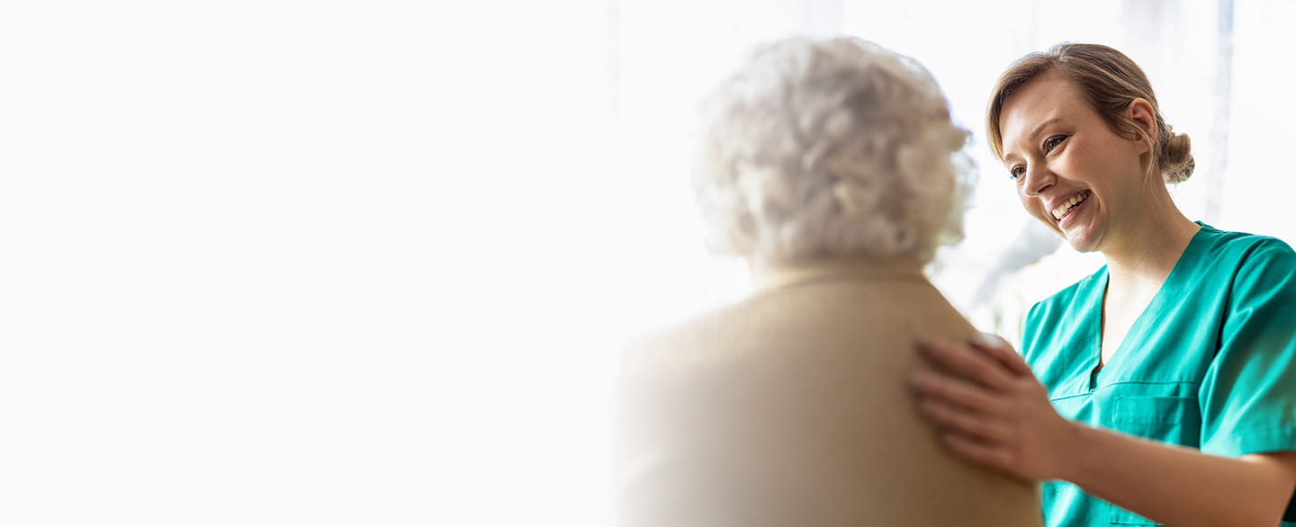 Medical staff speaking with a patient