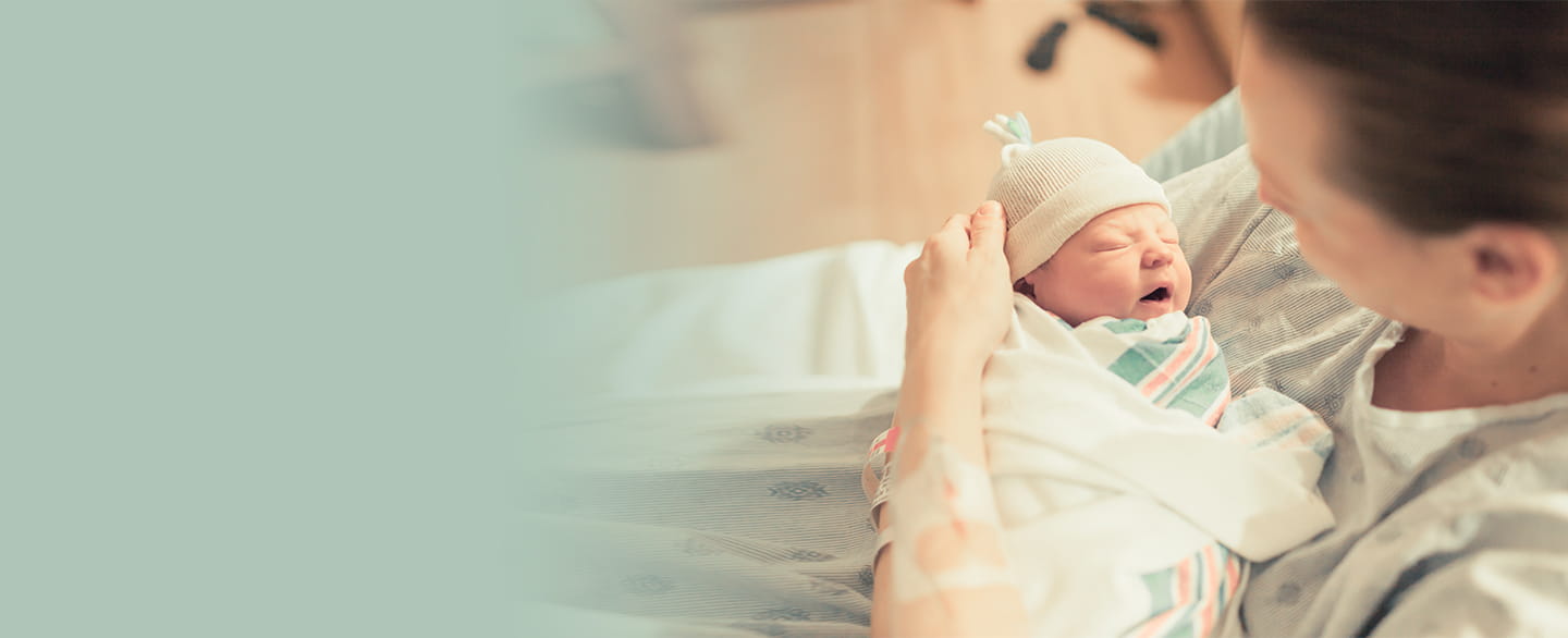 Mom holding her new baby.