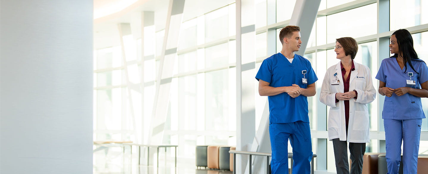 Doctor and nurses in hallway