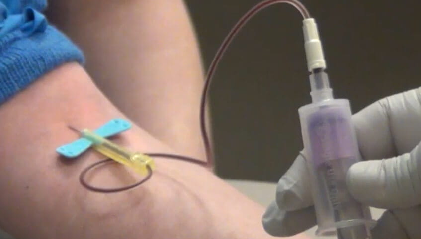 blood being drawn from patient's arm