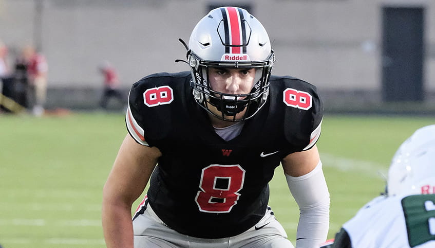 Zach Darche playing football