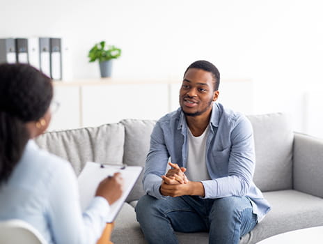 Young male speaking with his psychiatrist 
