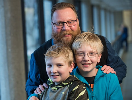 Heart patient John Findlay with his sons.
