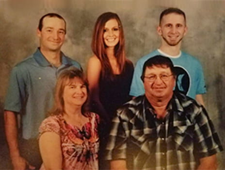 Burn patient Chris Gifford with his family.