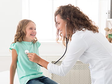 Doctor examining a child