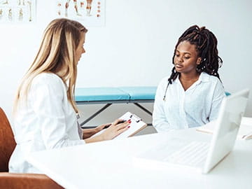 Doctor speaking with patient