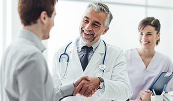 Doctor shaking patient's hand.