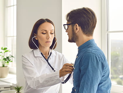 Doctor examining a patient with a stethoscope