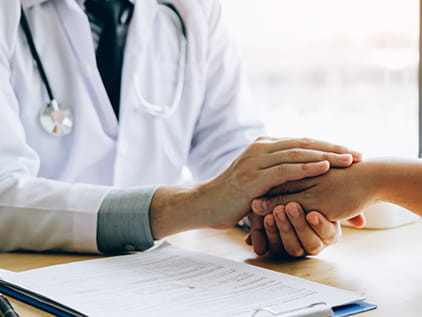 Doctor comforting a patient